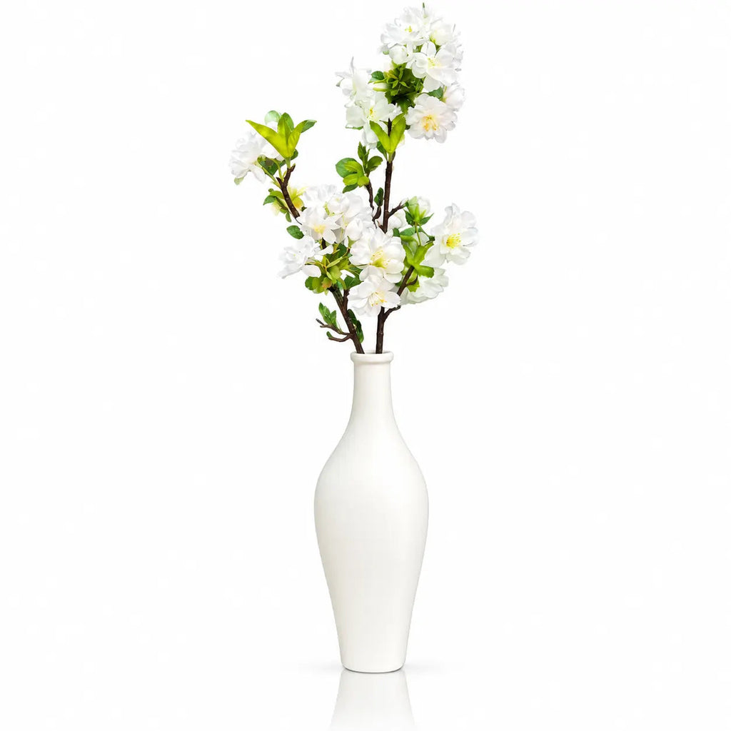 White faux floral tall white vase from Waterdale Collection, slim ceramic vase with white blossom branches and green leaves
