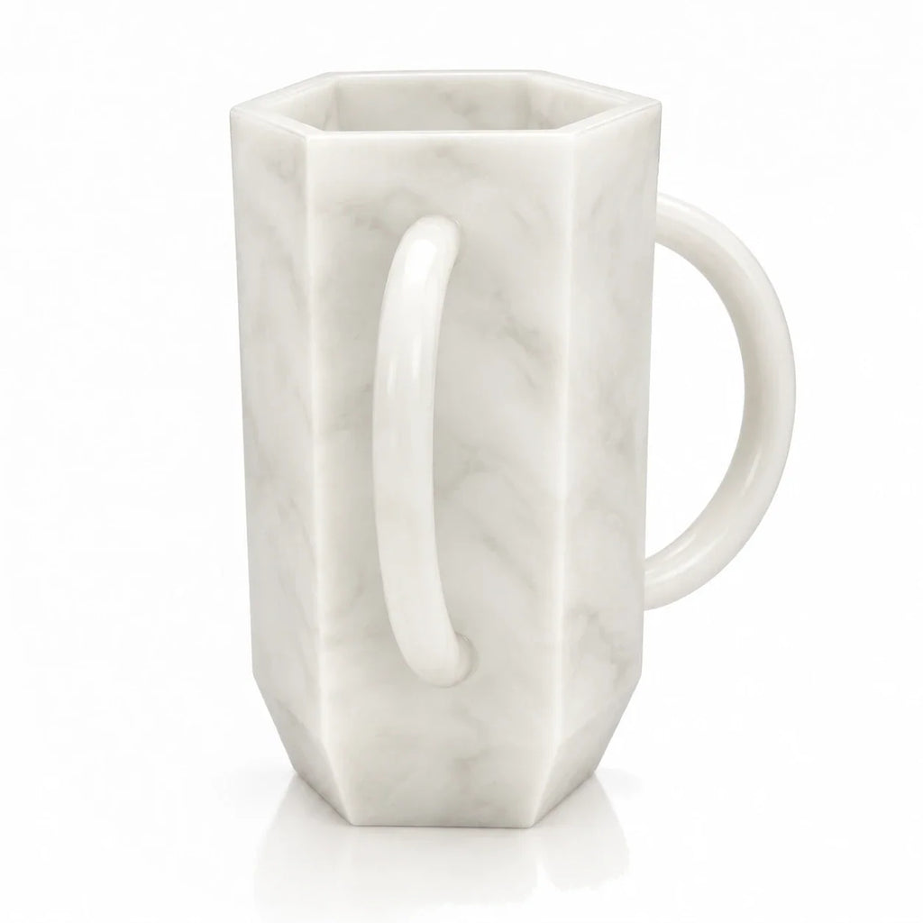 White marble-look resin hexagon wash cup with a loop handle for a modern washing station
