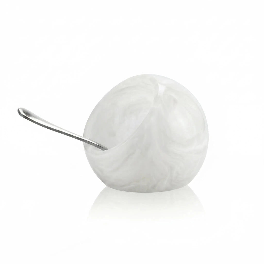 White resin salt cellar with metal spoon by Waterdale Collection, elegant tabletop accessory for dining and entertaining.