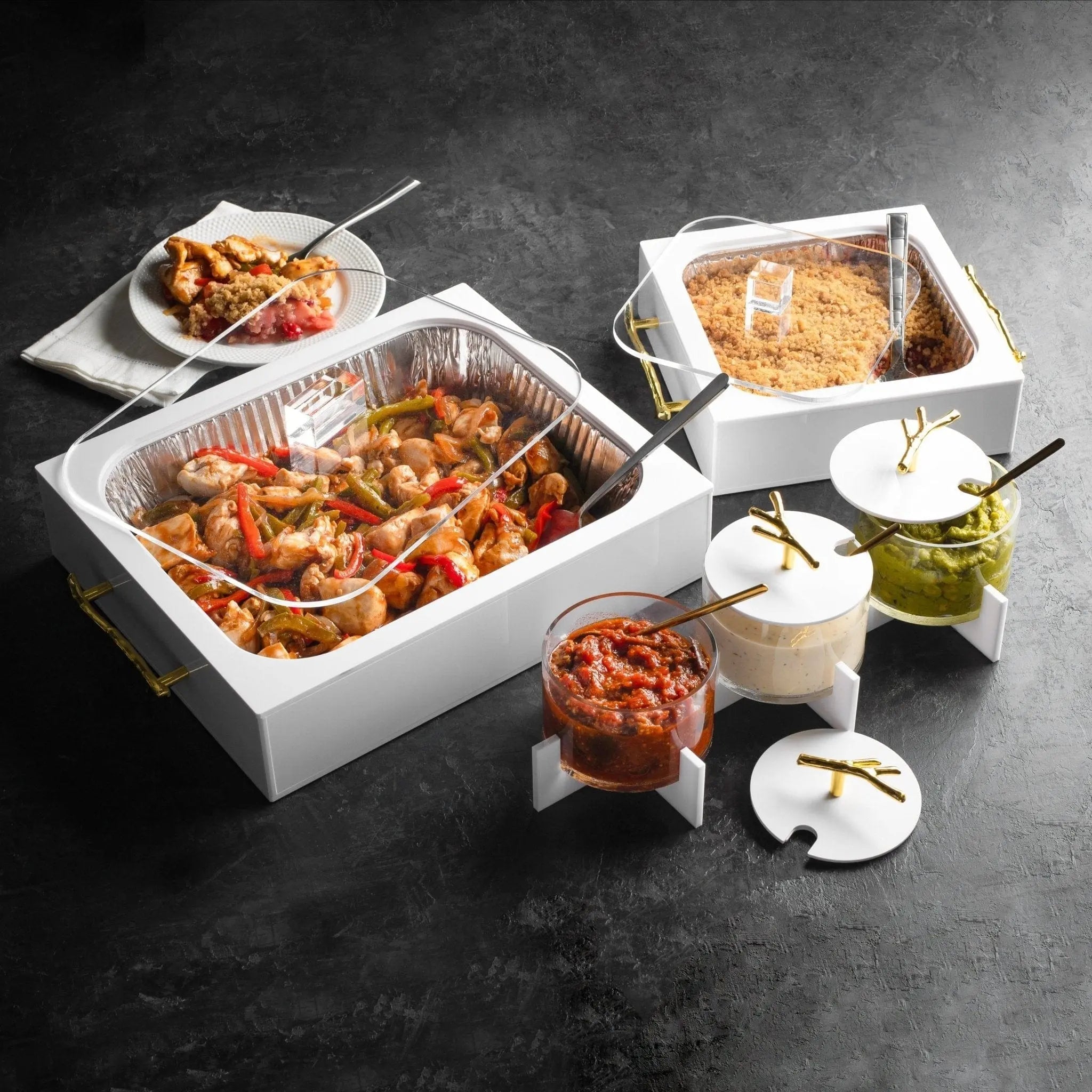 White rectangular Twig pan holder displaying casserole dishes and serving vessels on dark surface, elegant serveware for entertaining