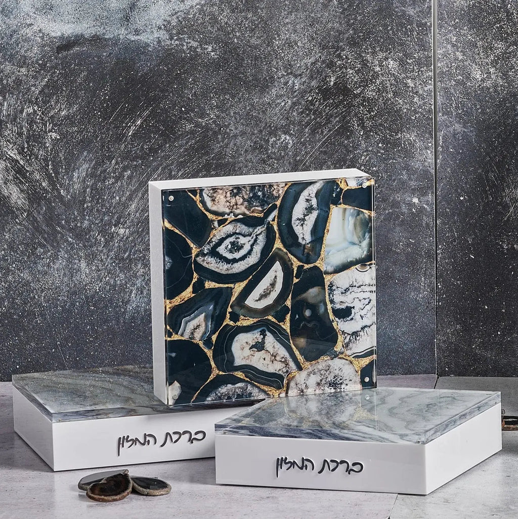 Agate Layflat Bencher Set featuring black and white striped agate with gold veining, displayed on white pedestals with natural agate specimens.