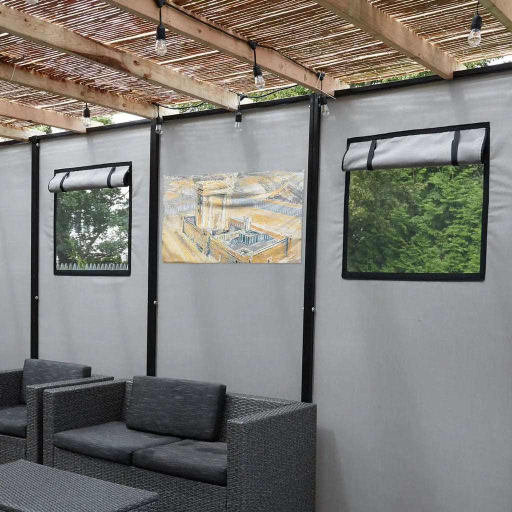 Gray and gold vinyl Bais Hamikdash sukkah decoration hanging on display wall with modern black seating below