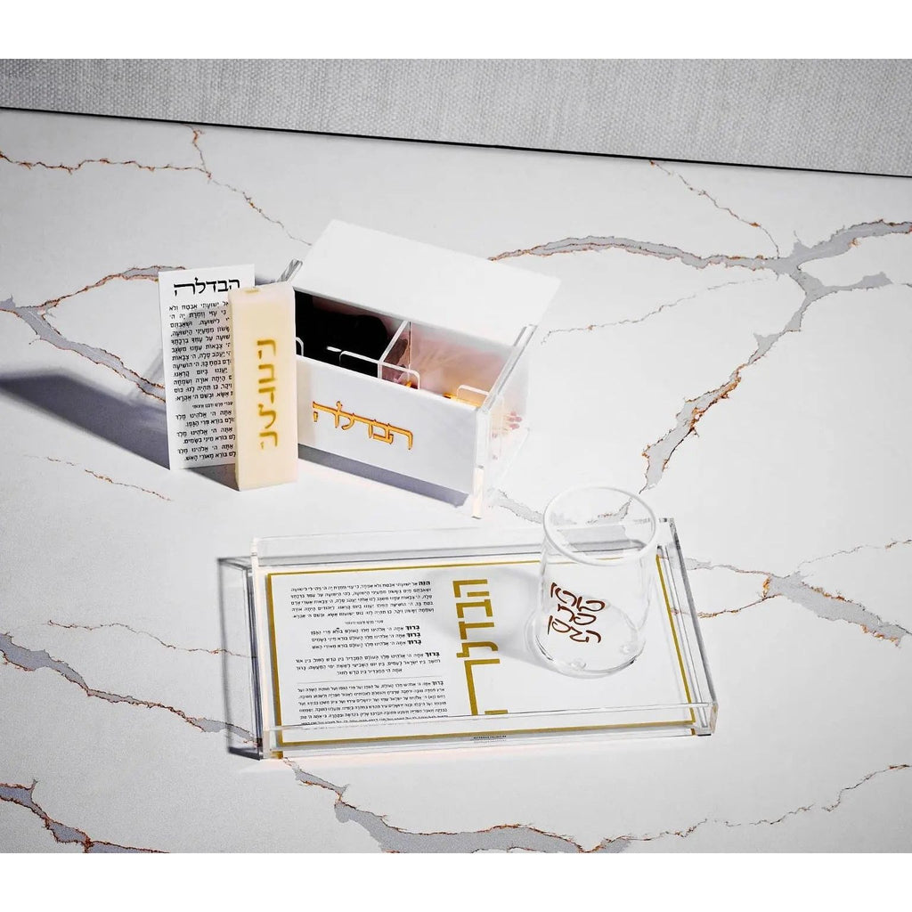 White marble Havdalah plate from Waterdale Collection with compartments for blessing items, displayed with product packaging on marble surface.