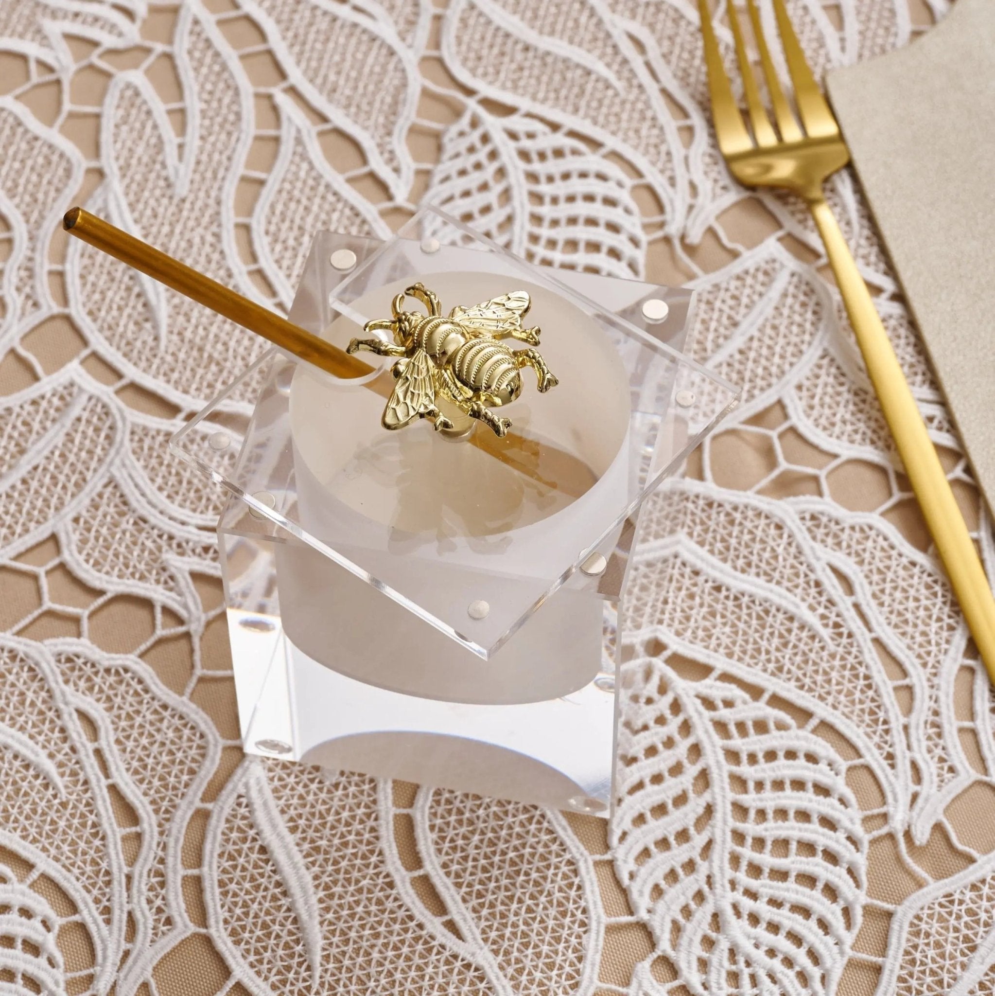 Ceramic bee honey dish with white and brown glazed finish, featuring decorative bee and honeycomb details on lid by Waterdale Collection.