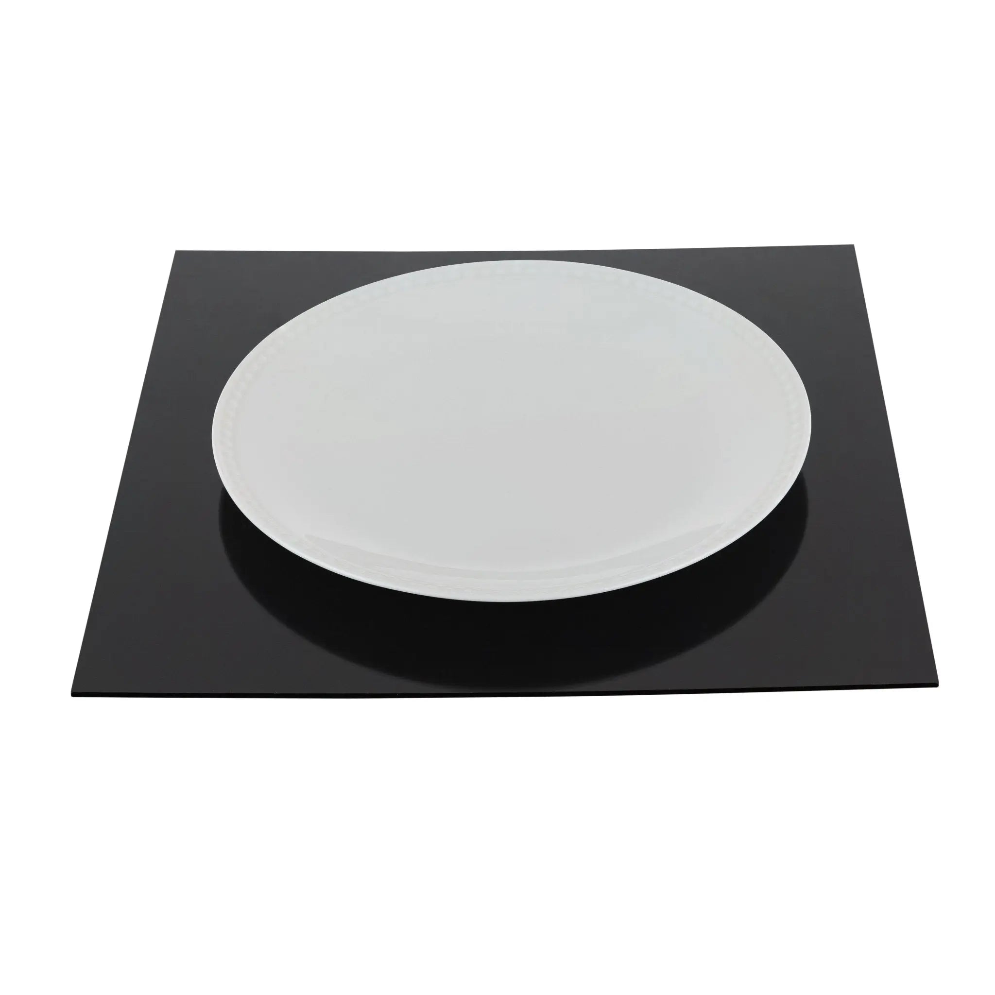 Black charger plate with white center, round ceramic design for formal table settings by Waterdale Collection