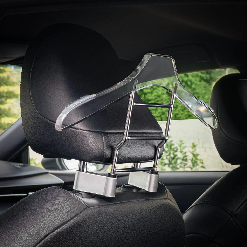 Black car hanger mounted on vehicle headrest, displaying organizational functionality with storage compartments for essentials.