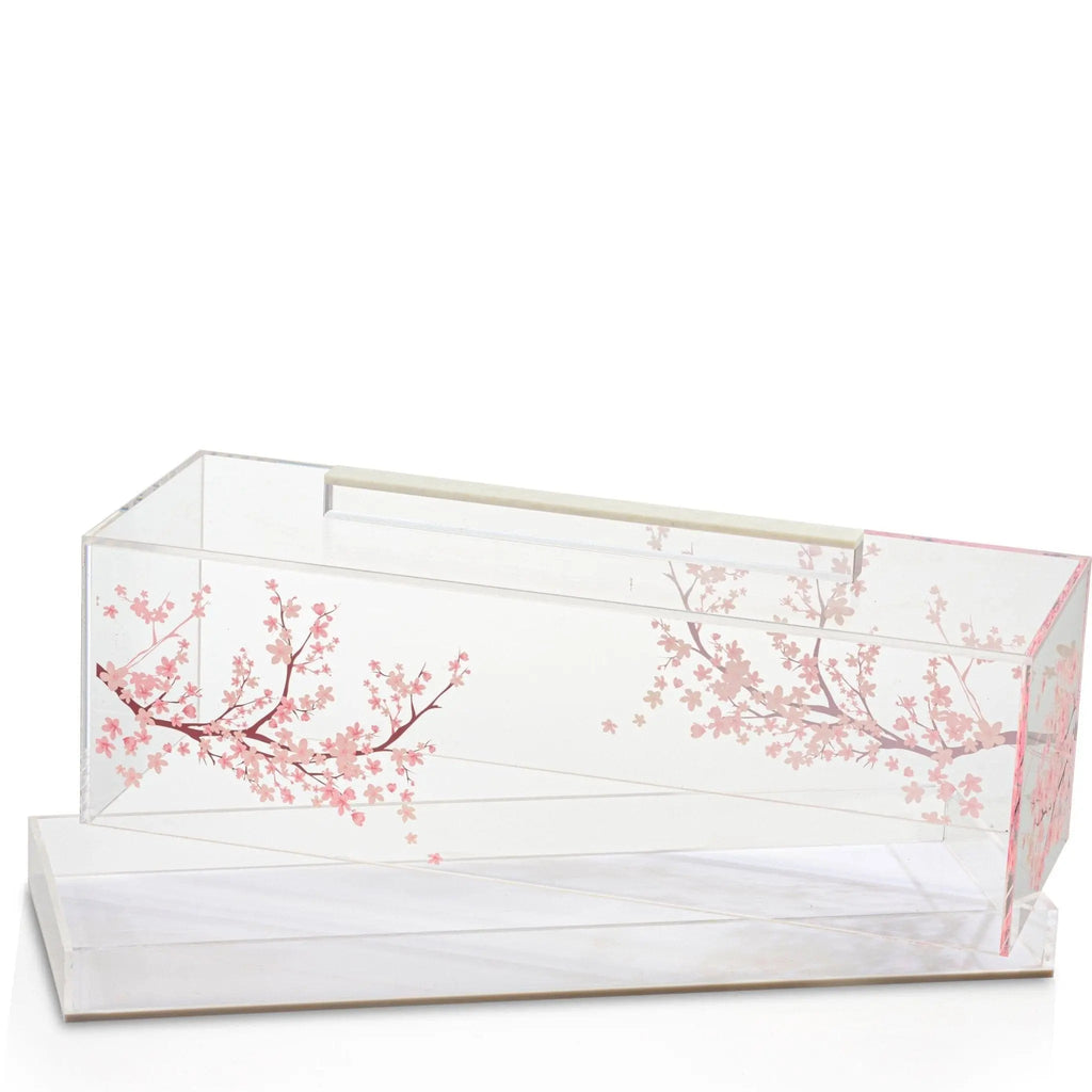 Clear acrylic cherry blossom cake dome with delicate pink floral design on white base, ideal for displaying and serving cakes.