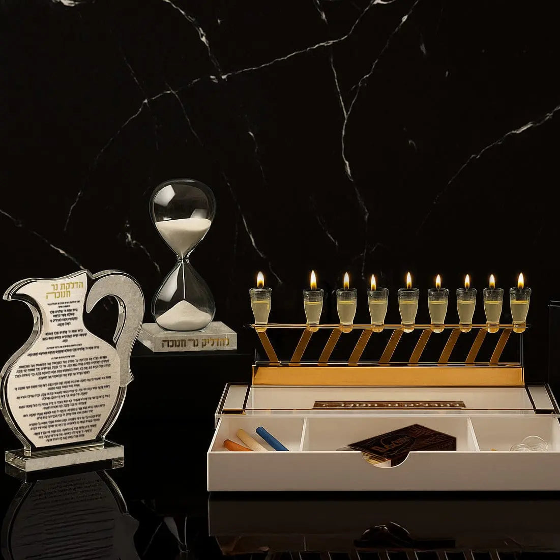 Classic 2.0 Menorah Tray with Drawer featuring white ceramic vessels and gold candle holders on black marble surface with storage drawer.