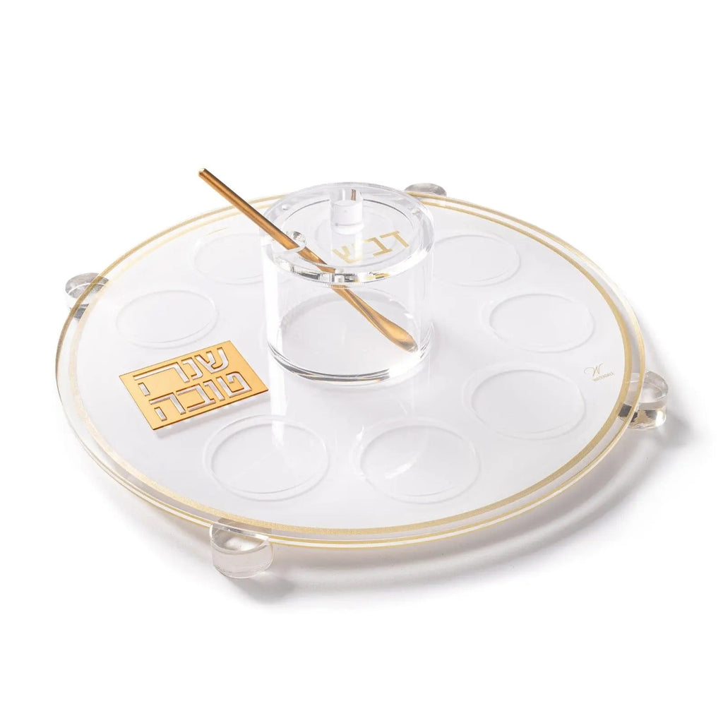 Classic 2.0 Simanim Tray with white compartments, gold accents, and wooden spoon on cream-colored base for Passover seder.