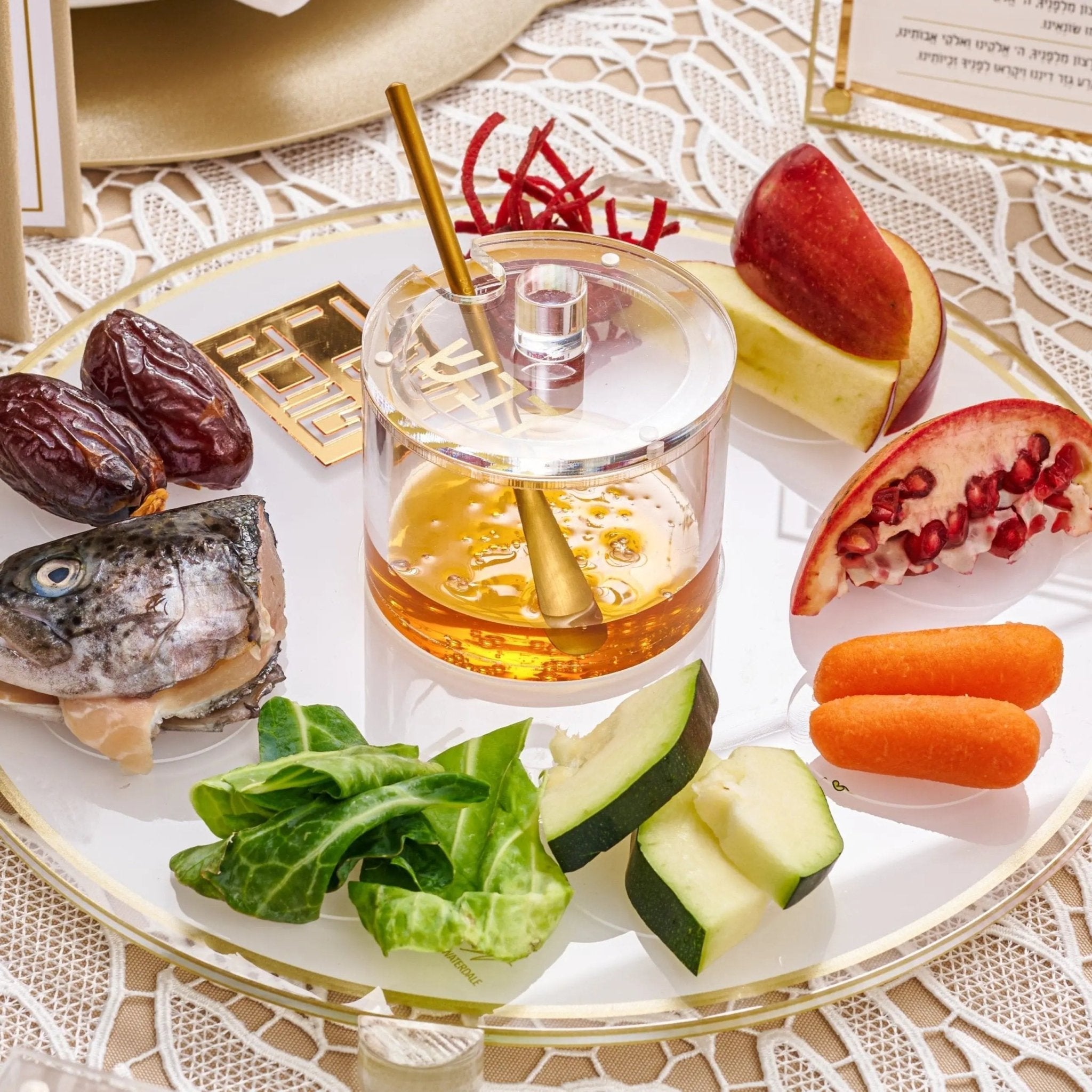 Classic 2.0 Simanim Tray by Waterdale Collection displaying traditional Passover foods including lettuce, apple, egg, and pomegranate on round clear glass dish.