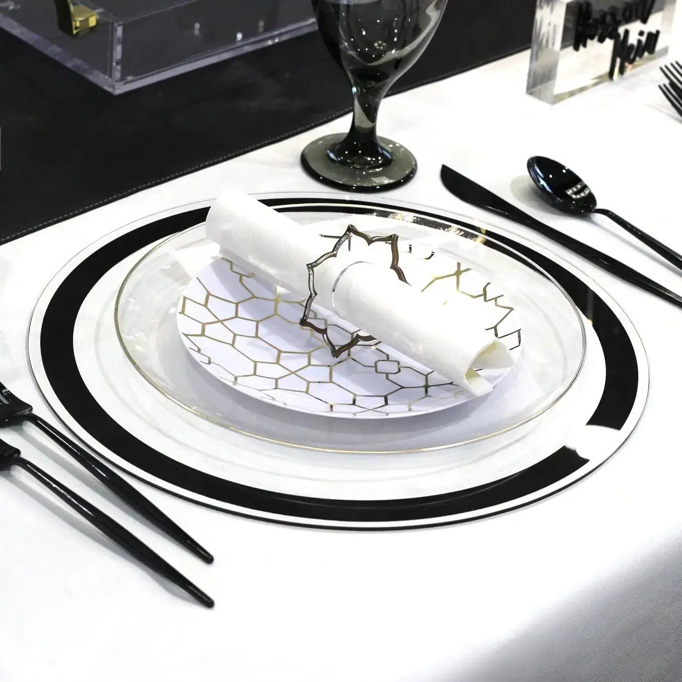 Classic black and silver border charger plate by Waterdale Collection, elegant round design with ornate detailing for formal table settings.