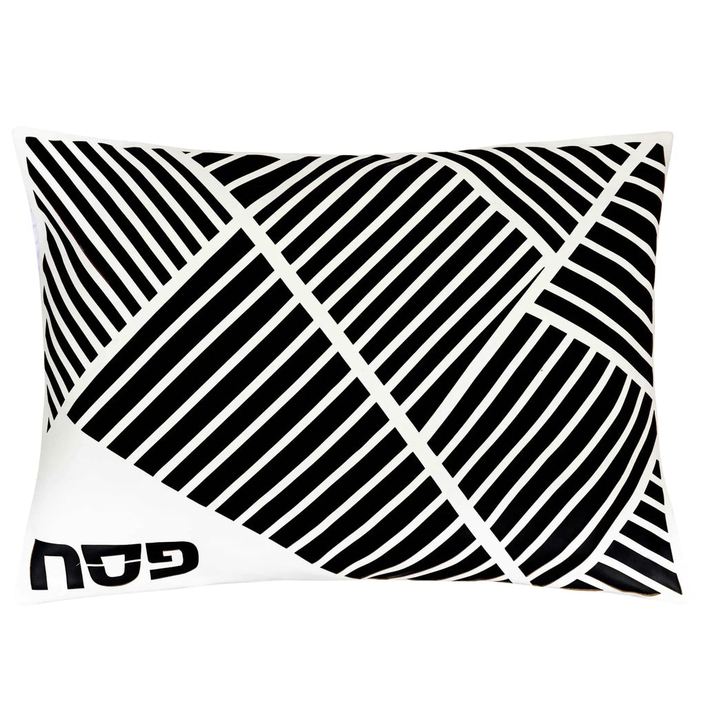 Black and white diagonal laser-cut leather Pesach set with geometric striped pattern design and Waterdale Collection branding visible.