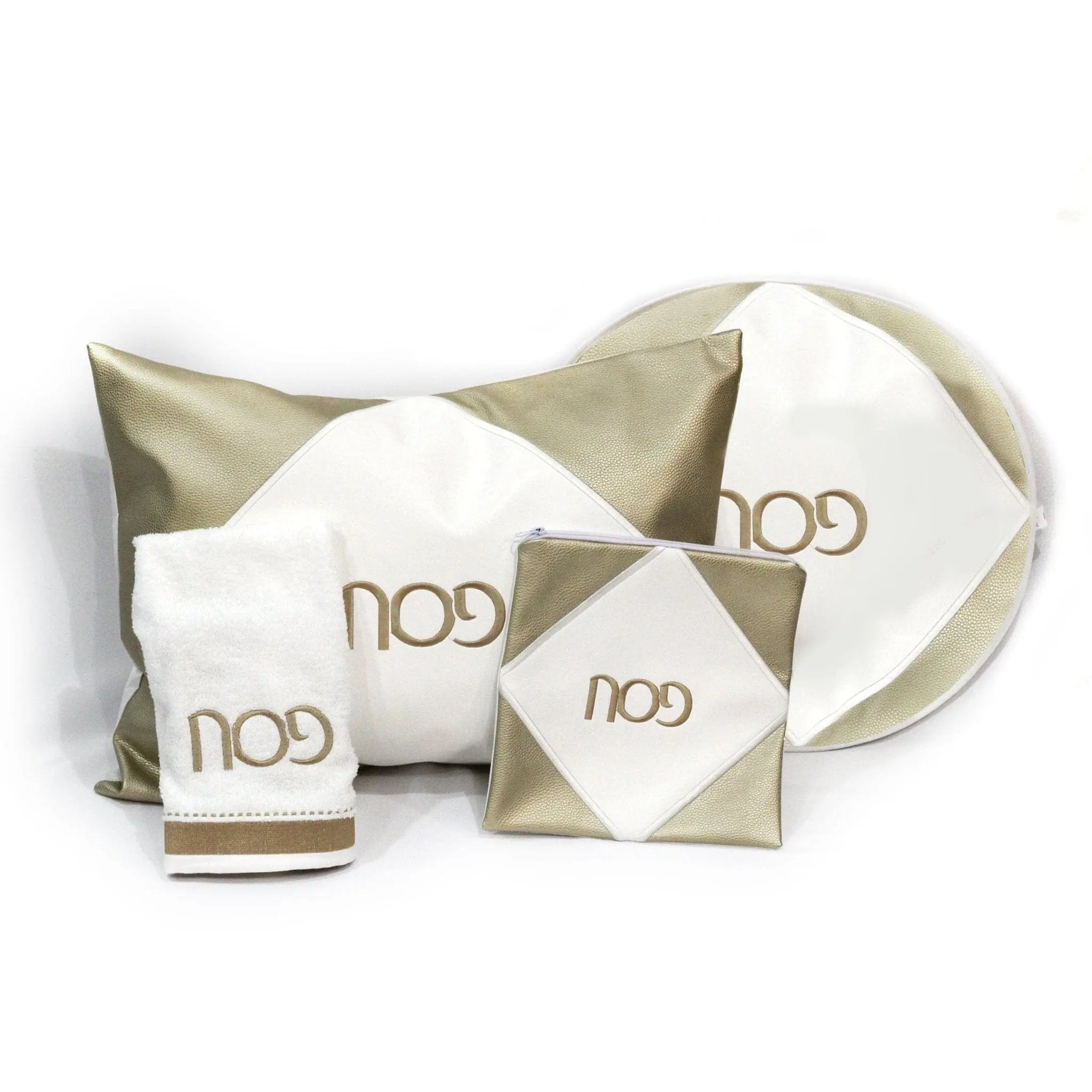 Diamond Pesach Set in cream and gold leather by Waterdale Collection, showing matching matzah cover, afikoman pouch, and serving pieces arranged on white background.