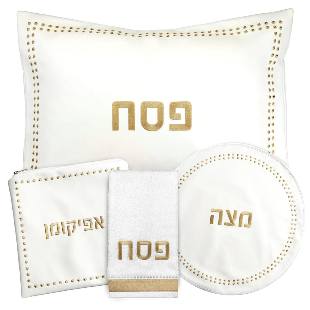 Dot Border Pesach Set with cream leather plates and bowls featuring gold Hebrew text, by Waterdale Collection