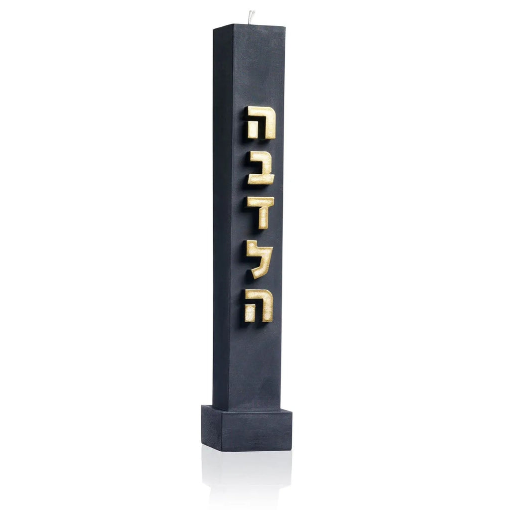 Black embossed Havdalah candle with white text detail, standing upright on square base, traditional Jewish ceremonial candle design.