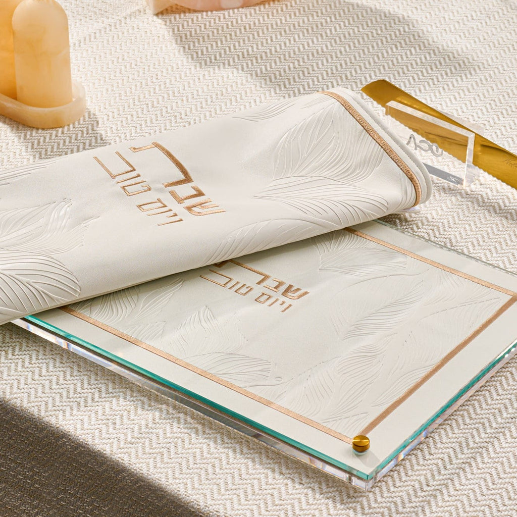 Leather and Lucite challah board and cover on a set shabbos table from waterdale collection