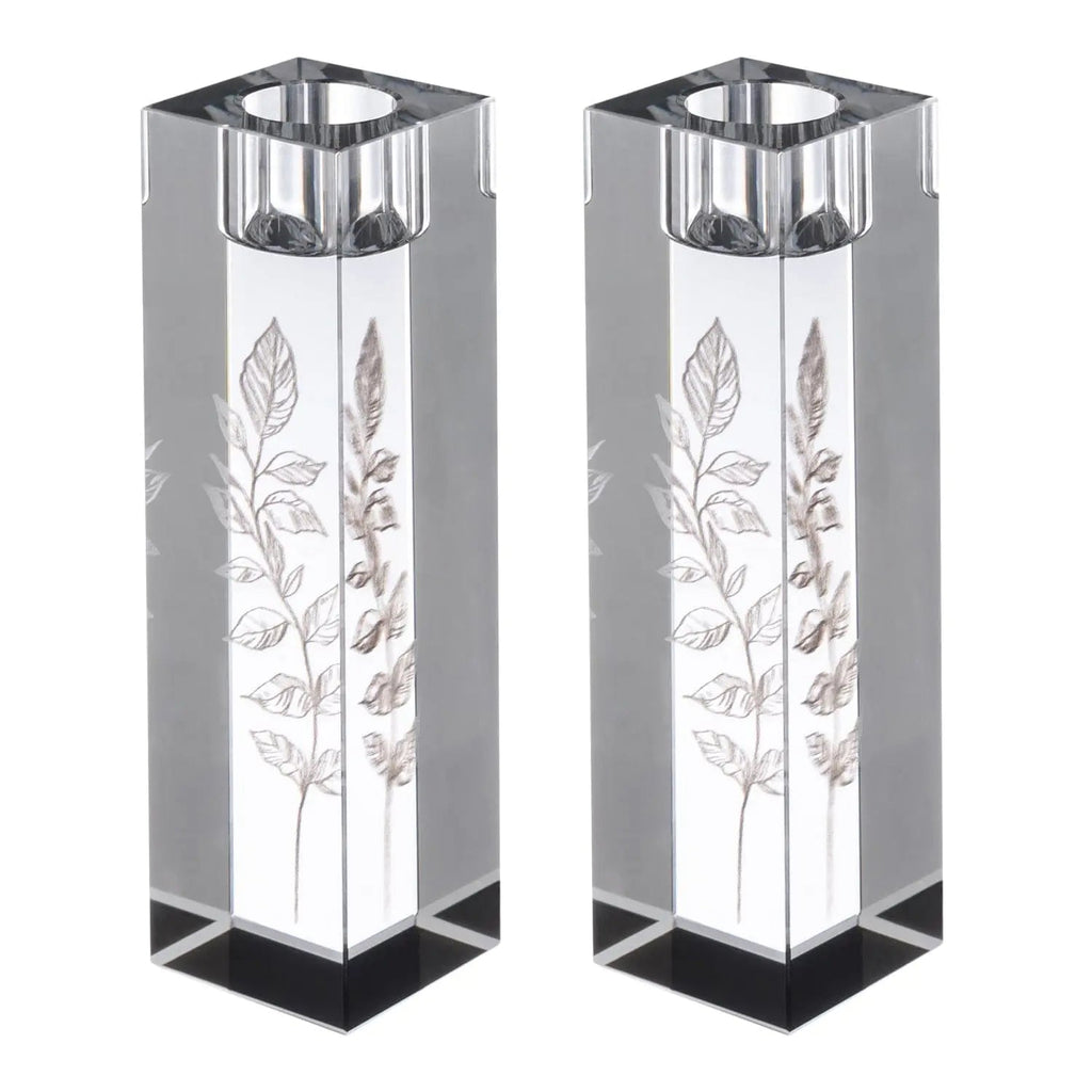 Pair of tall crystal candlesticks with engraved leaf designs and metal tops, ideal for Shabbat candle lighting ceremonies.
