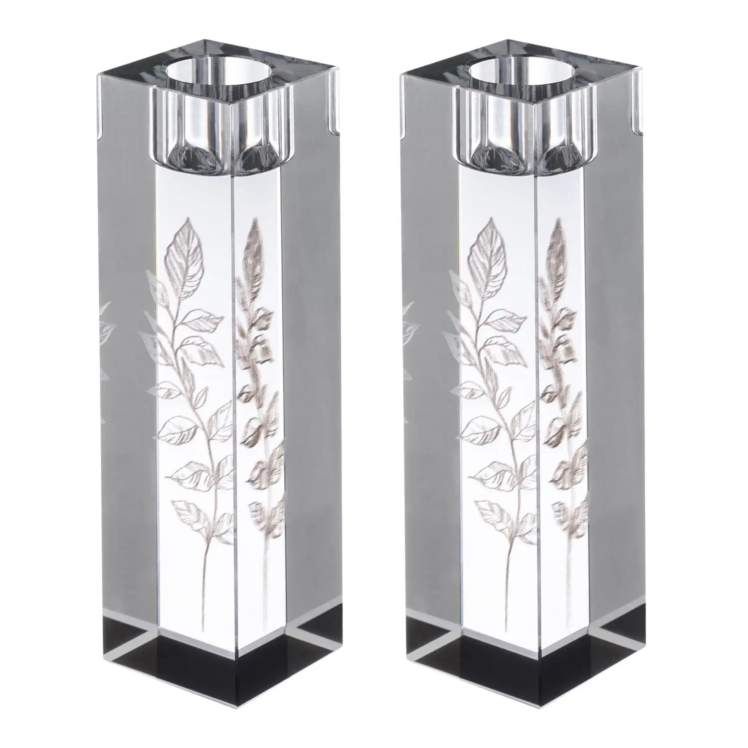 Pair of tall crystal candlesticks with engraved leaf designs and metal tops, ideal for Shabbat candle lighting ceremonies.