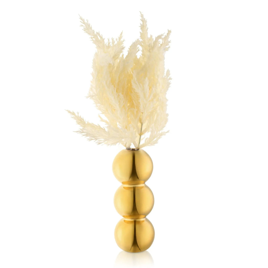 Gold spheres stacked in a vase with dried pampas grass faux floral arrangement by Waterdale Collection