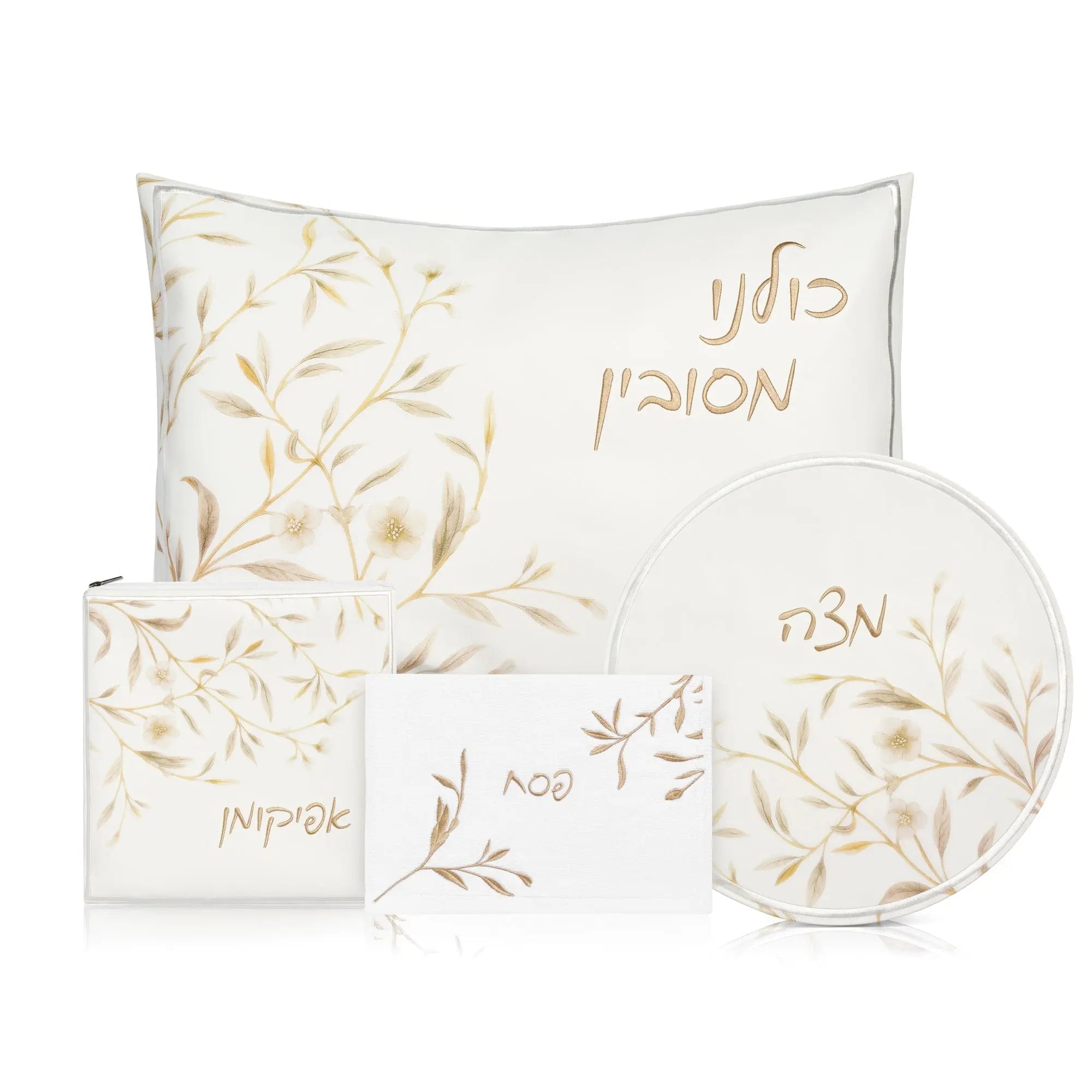 Floral Bird Pesach Set in gold and white featuring matching placemats, napkins, and decorative plates with leaf design
