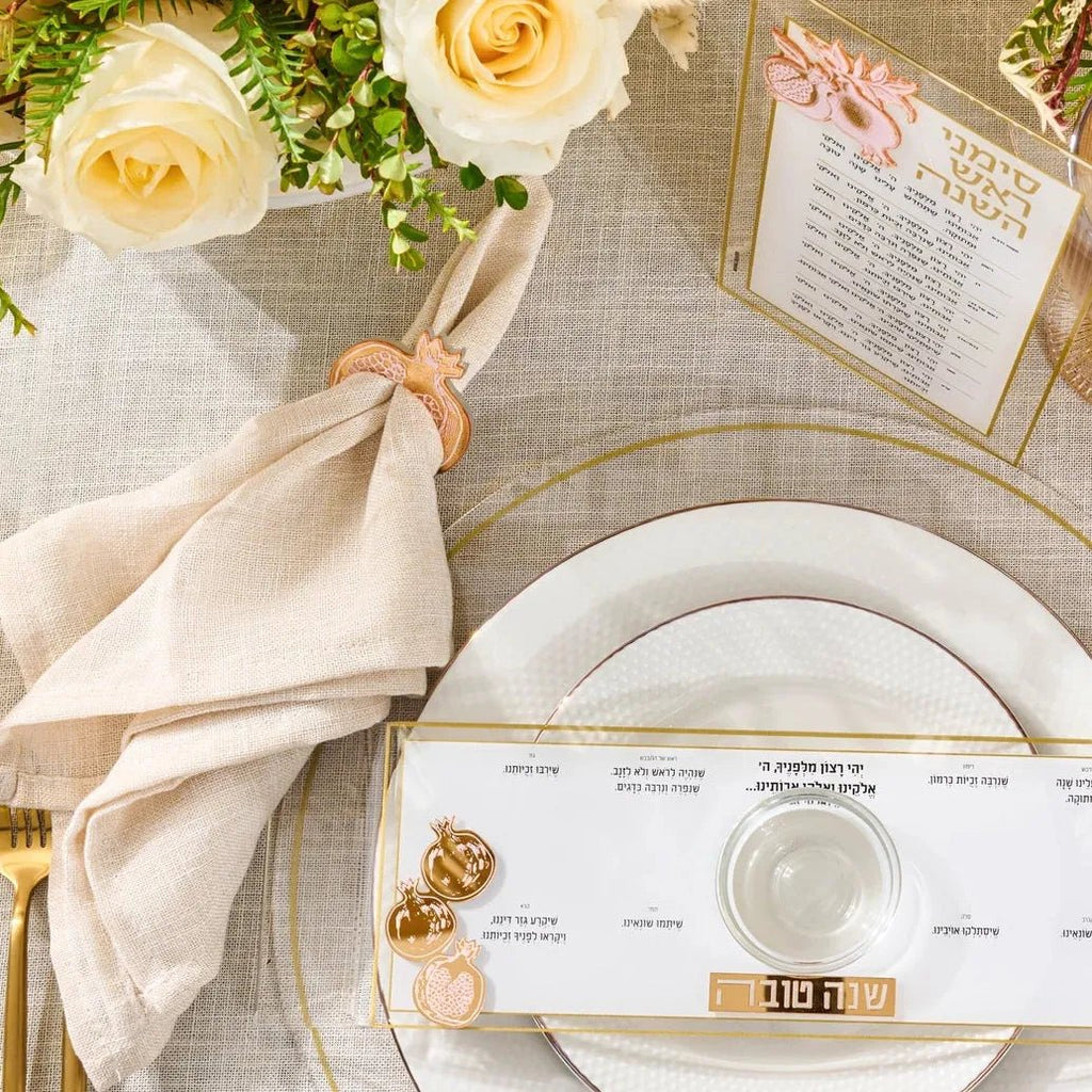 Gold mirror pomegranate napkin rings for a Rosh Hashanah place setting