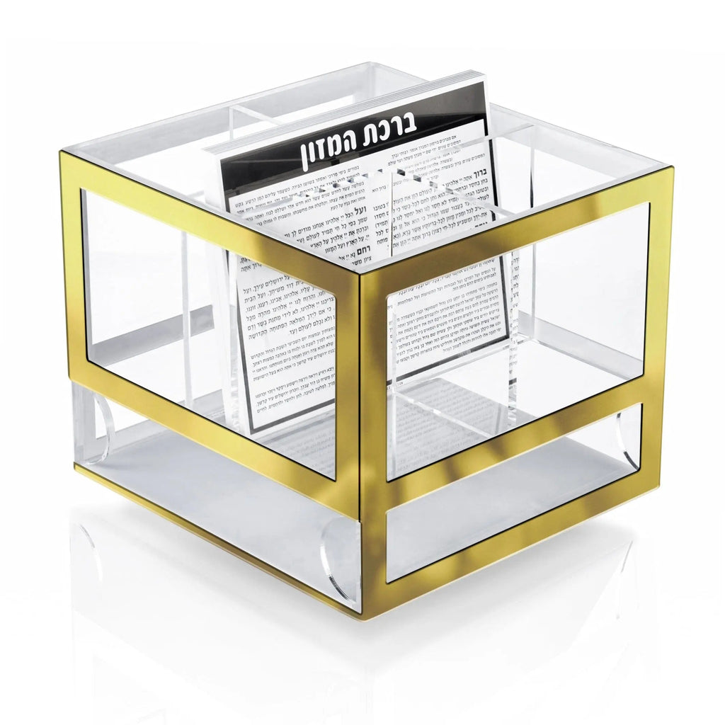 Gold and clear glass silverware caddy with metal frame and handles, perfect for organizing flatware and serving utensils at the table.