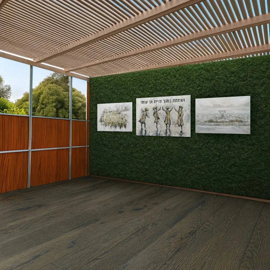 Greenery vinyl mural by Batya displayed on sukkah wall with botanical artwork prints and corrugated roof detail above wooden floor.
