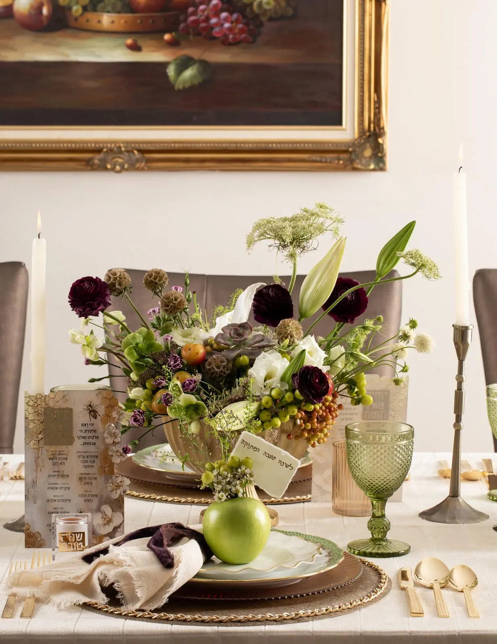 Honeycomb Simanim Card with painted floral design displayed on elegant table setting with flowers and holiday decorations.