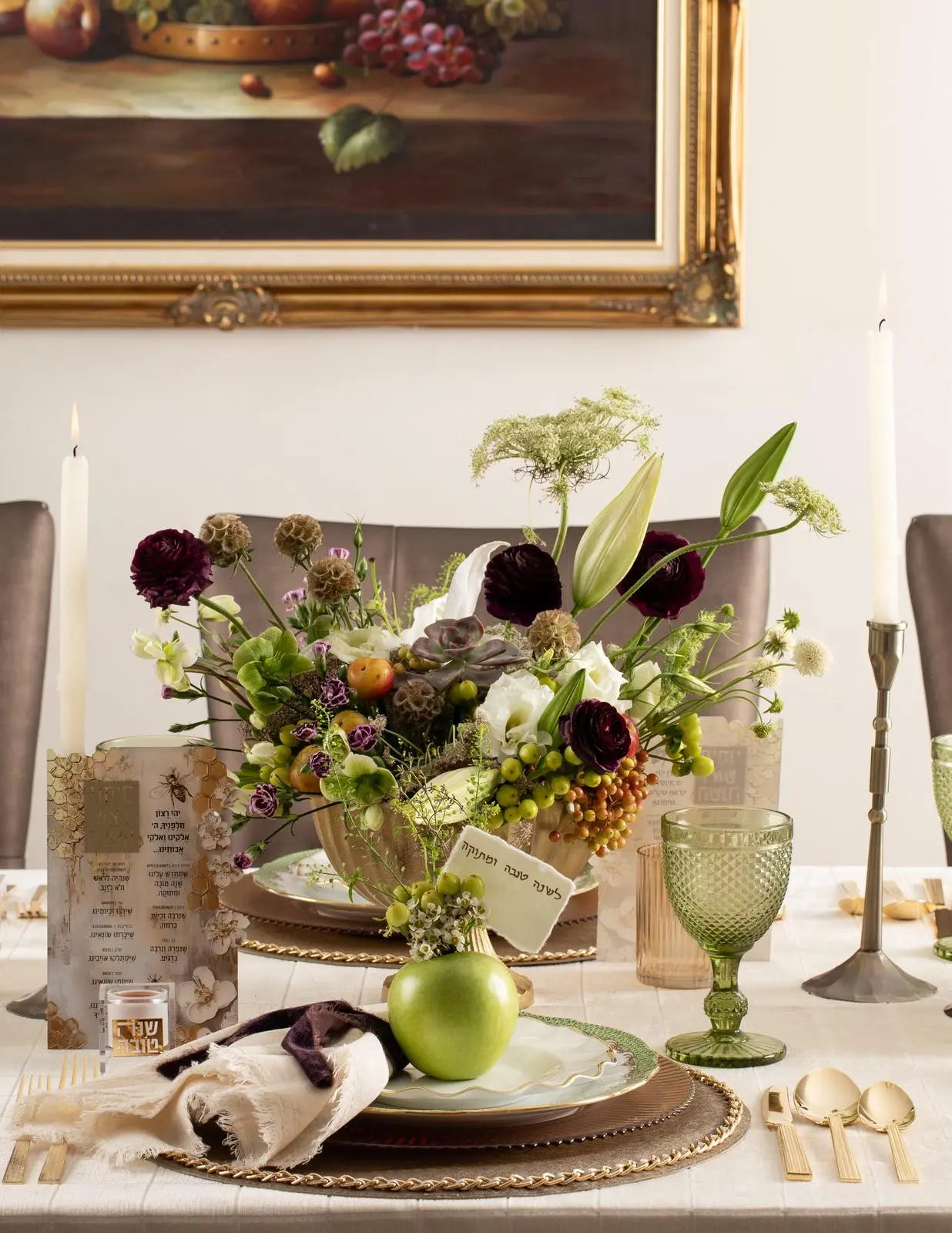 Honeycomb Simanim Card with painted floral design displayed on elegant table setting with flowers and holiday decorations.