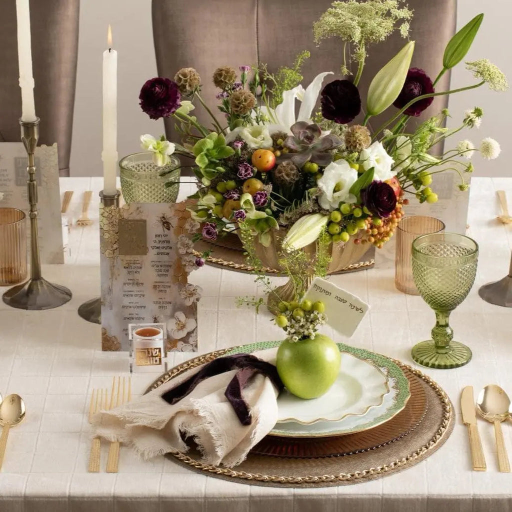 Honeycomb Simanim Card featuring hand-painted design in cream and earth tones, displayed on table setting with flowers and place card holder.