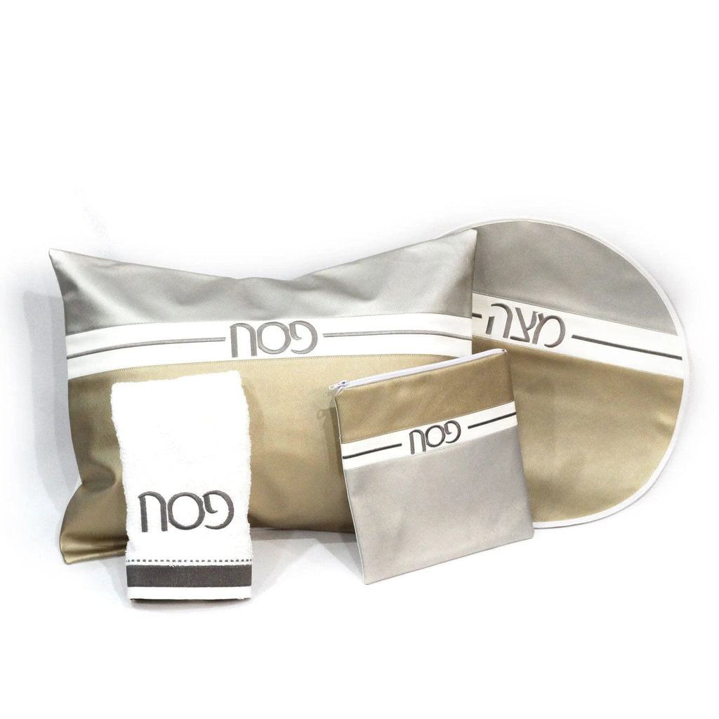 Horizontal Pesach Set in white and gold leather with multiple compartments and pouches arranged on white background.