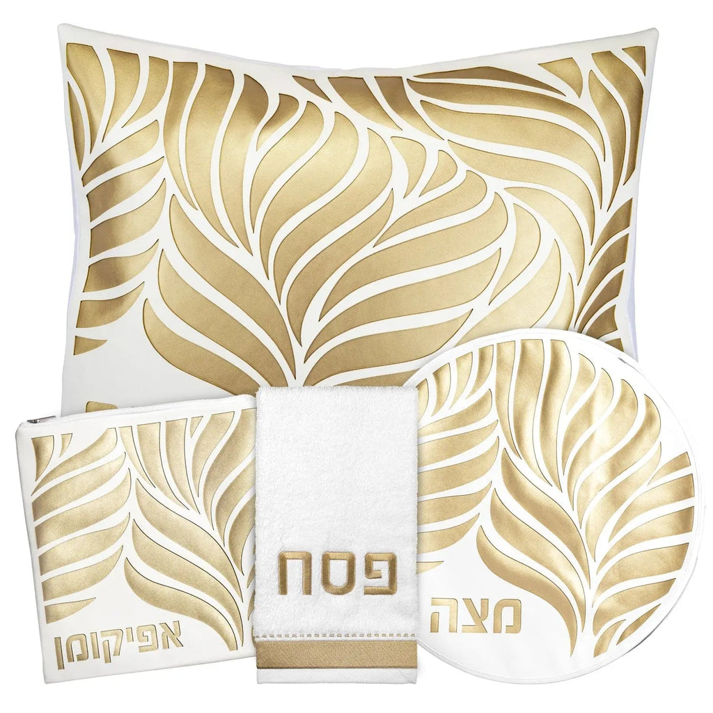 Gold and cream leaf-patterned Pesach leather placemats and napkins set by Waterdale Collection with laser-cut details.