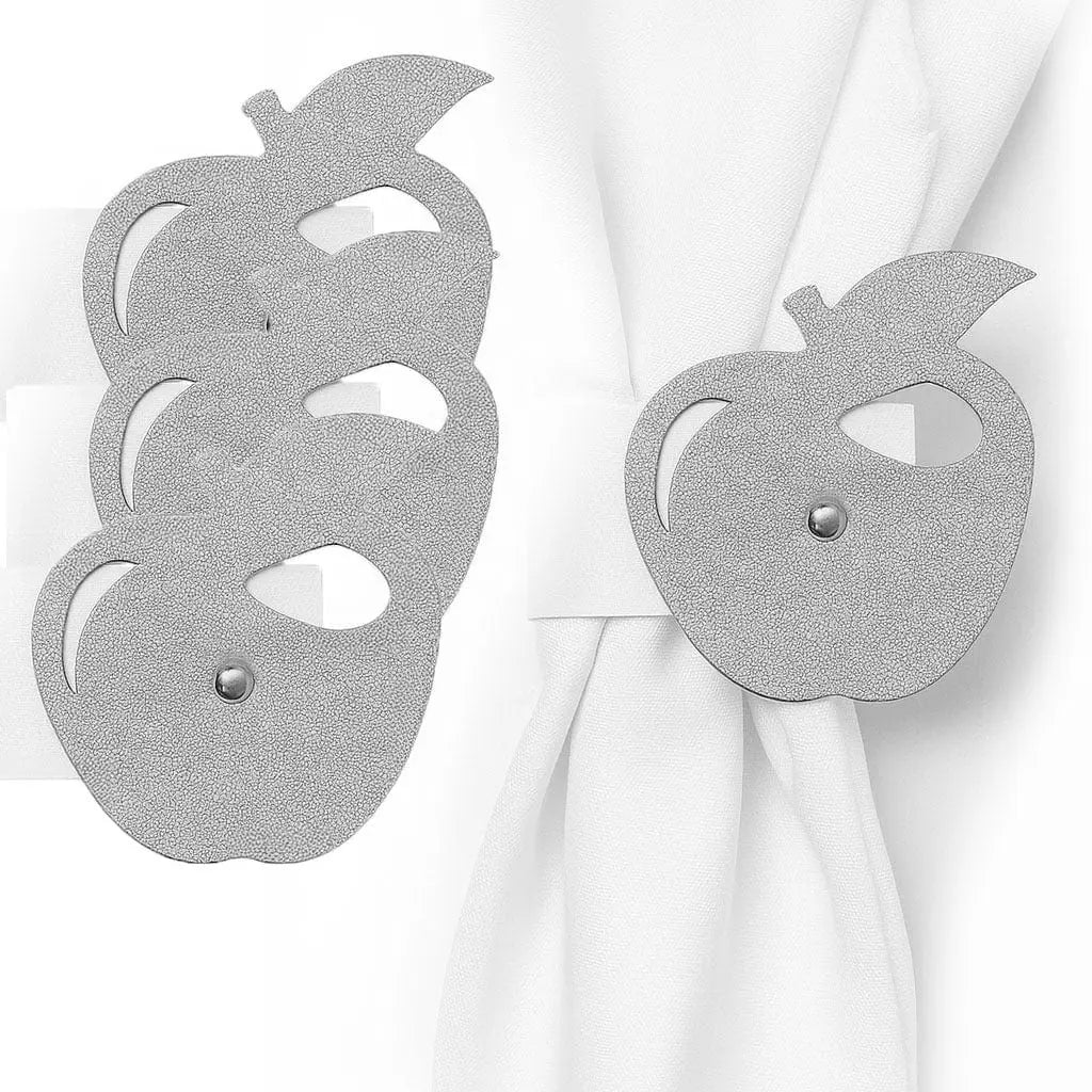 Silver leatherette apple-shaped napkin rings holding white napkins, set of four by Waterdale Collection for elegant table settings.