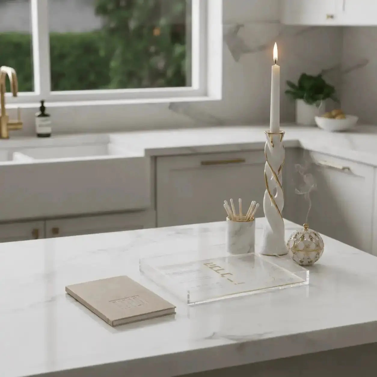 Tan leather Havdalah booklet displayed on white desk with notebook and candle holder in modern home setting.