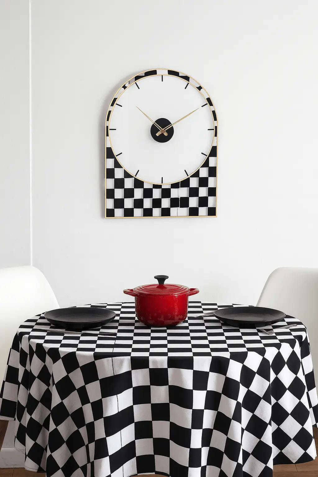 Onyx Collection Lucite wall clock with black and white checkered pattern, displayed above a matching checkered table with red vase.