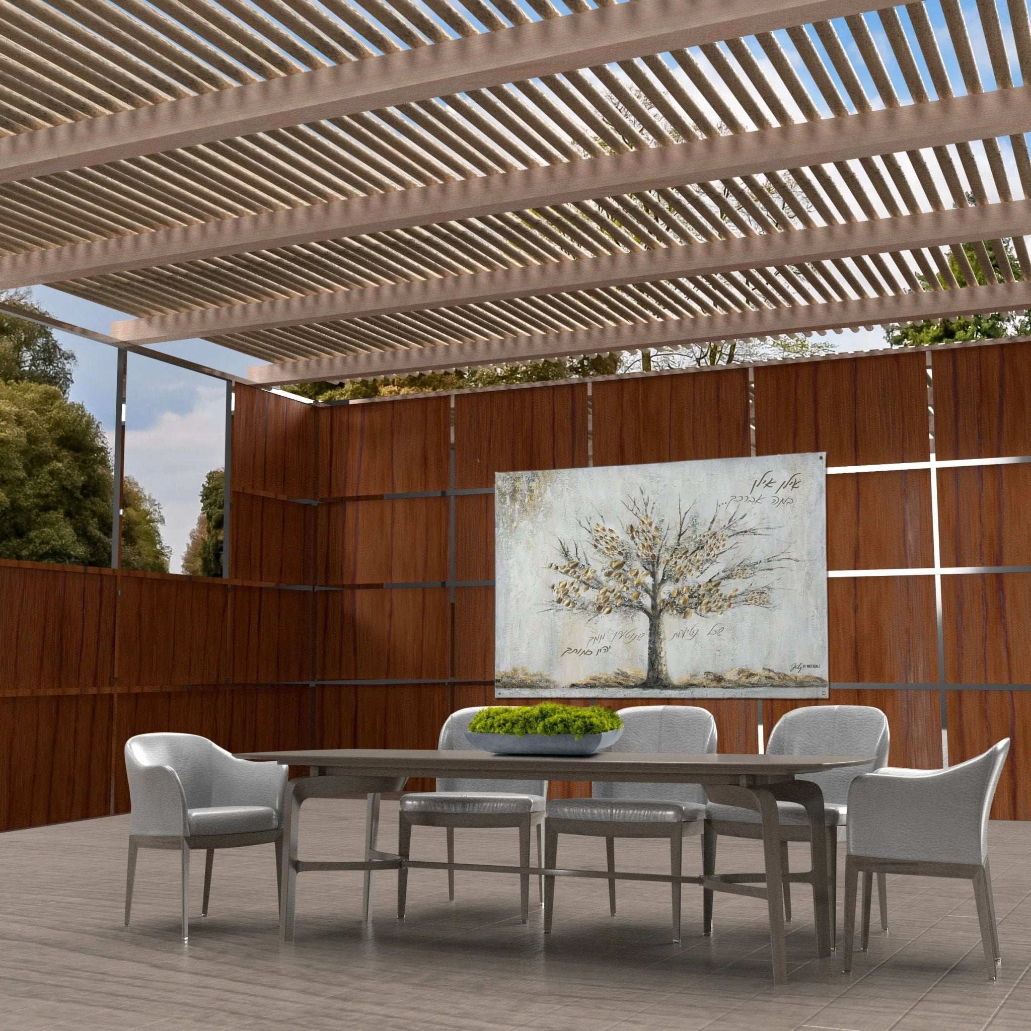 Painted by Judy Family Tree vinyl sukkah decoration displayed on an indoor sukkah wall with wooden panels and slatted roof.
