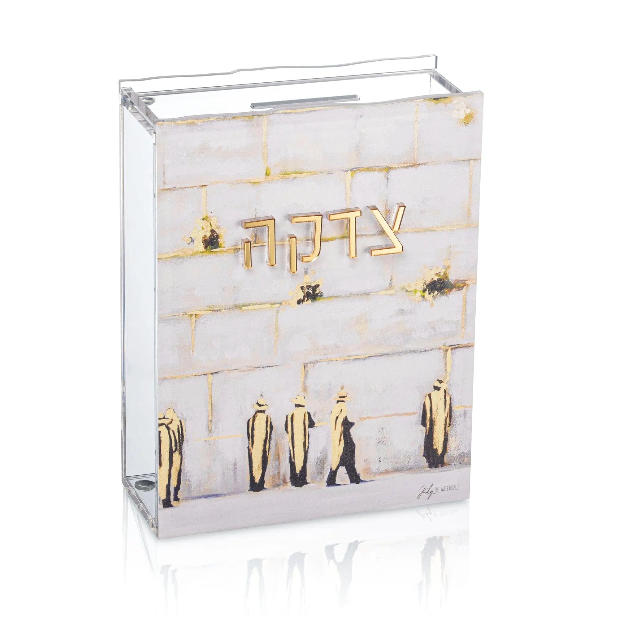 Clear acrylic Tzedakah box by Painted by Judy featuring gold Jerusalem Kosel design with compartments and metal hardware for charitable giving.