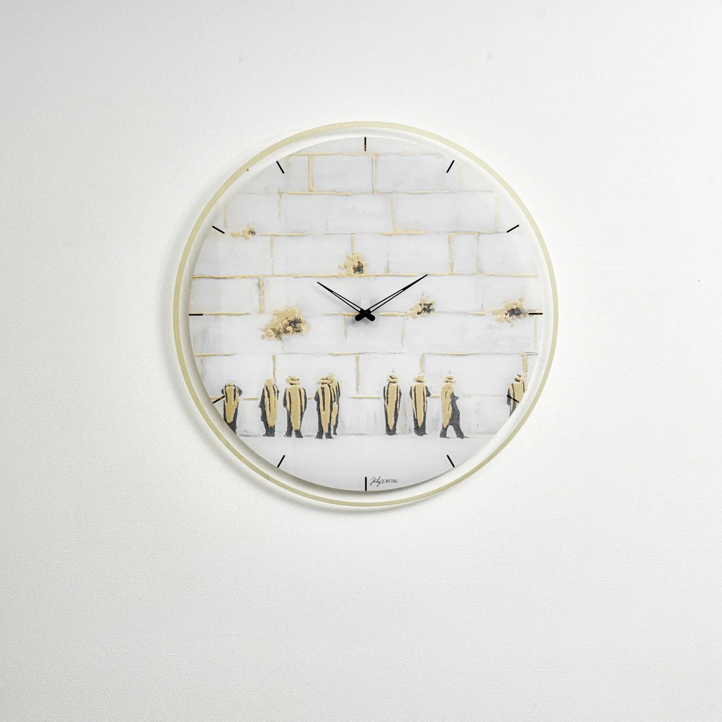 Painted Kosel wall clock with white face, gold-toned numerals and hands, featuring decorative elements on a light background.