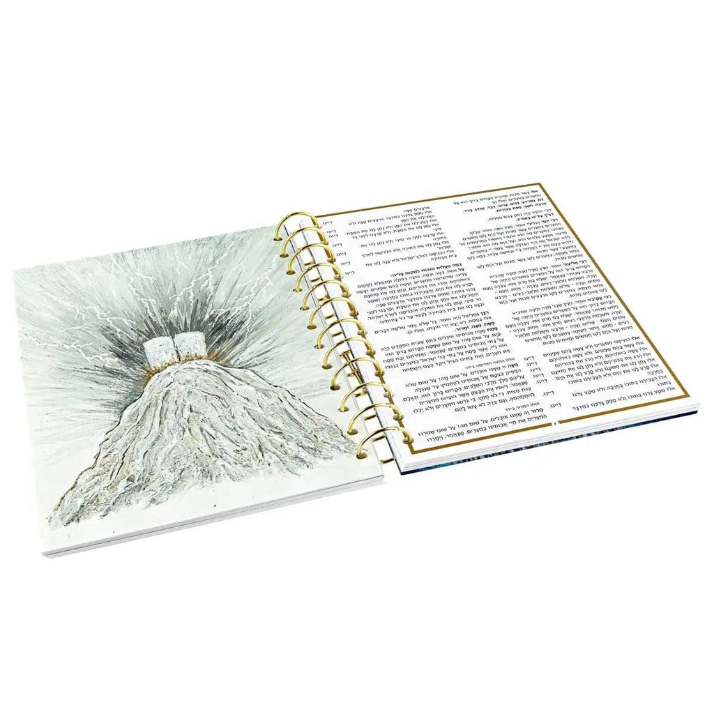 Painted Krias Yam Suf Haggadah with spiral binding, featuring illustrated cover art and text pages for Passover Seder.