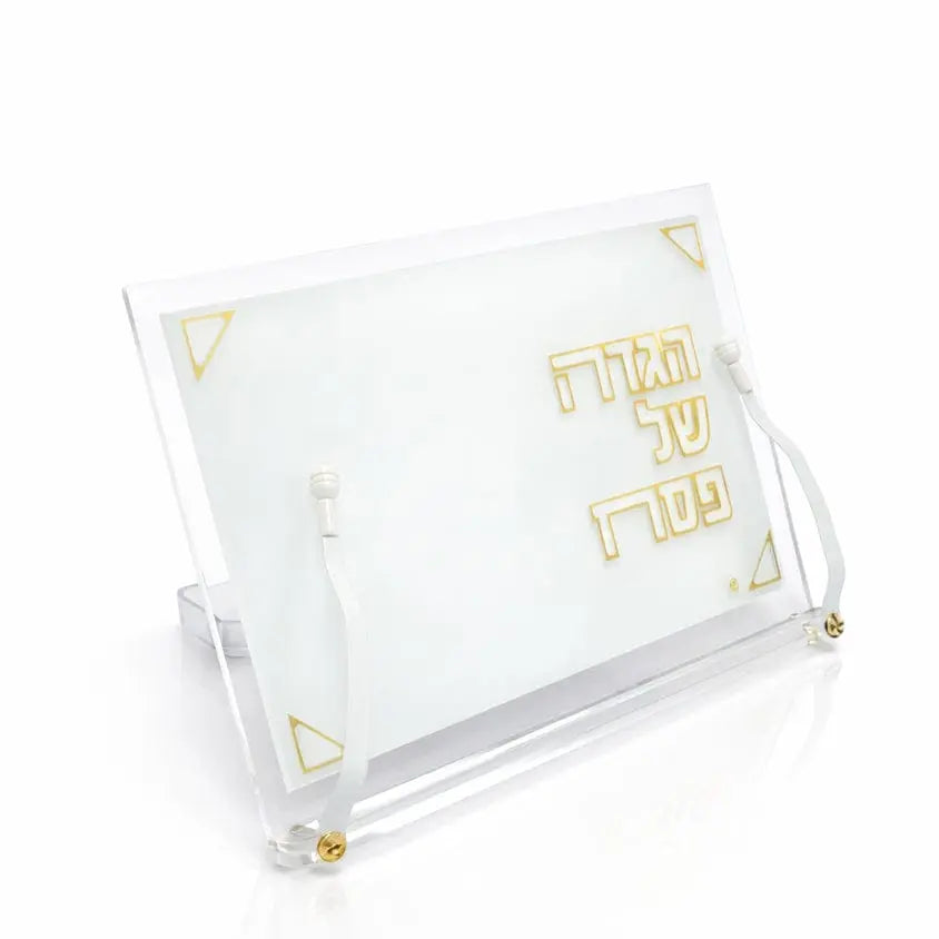Pearlstone Haggadah stand with clear lucite frame and white pearl marble base, displaying gold text for Passover table.