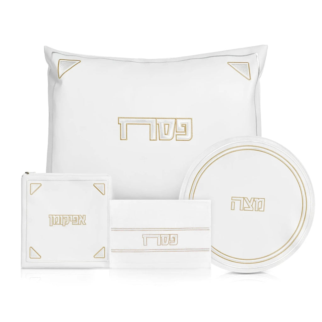 Pearlstone Pesach set with white leather items and gold accents, including pillow, placemat, plate, and napkin holder for holiday table settings.