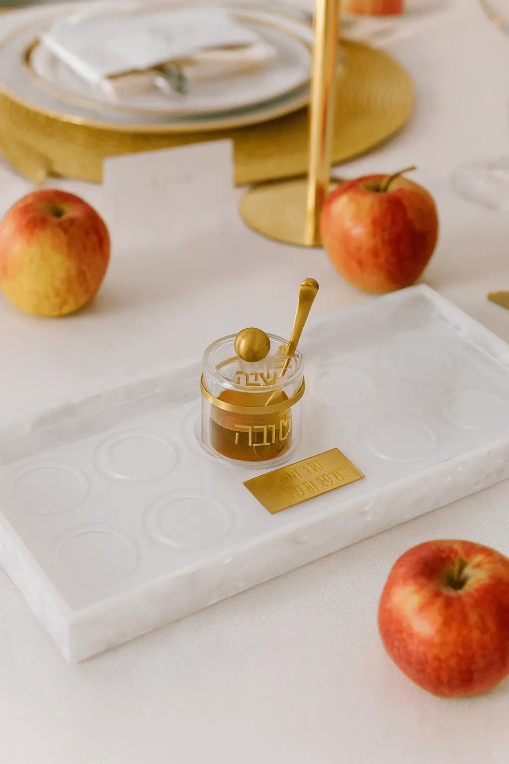 Pearlstone Simanim Tray by Waterdale Collection with pearl marble finish, styled with apples and honey for Rosh Hashanah holiday table setting.