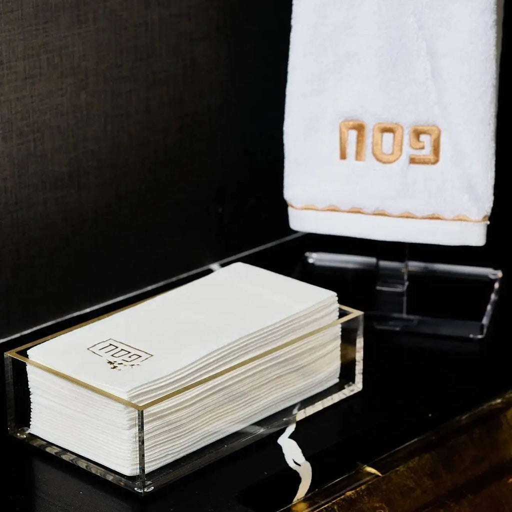 Waterdale Collection Pesach guest towelettes in cream and gold, displayed on dark surface with elegant packaging for holiday table settings.