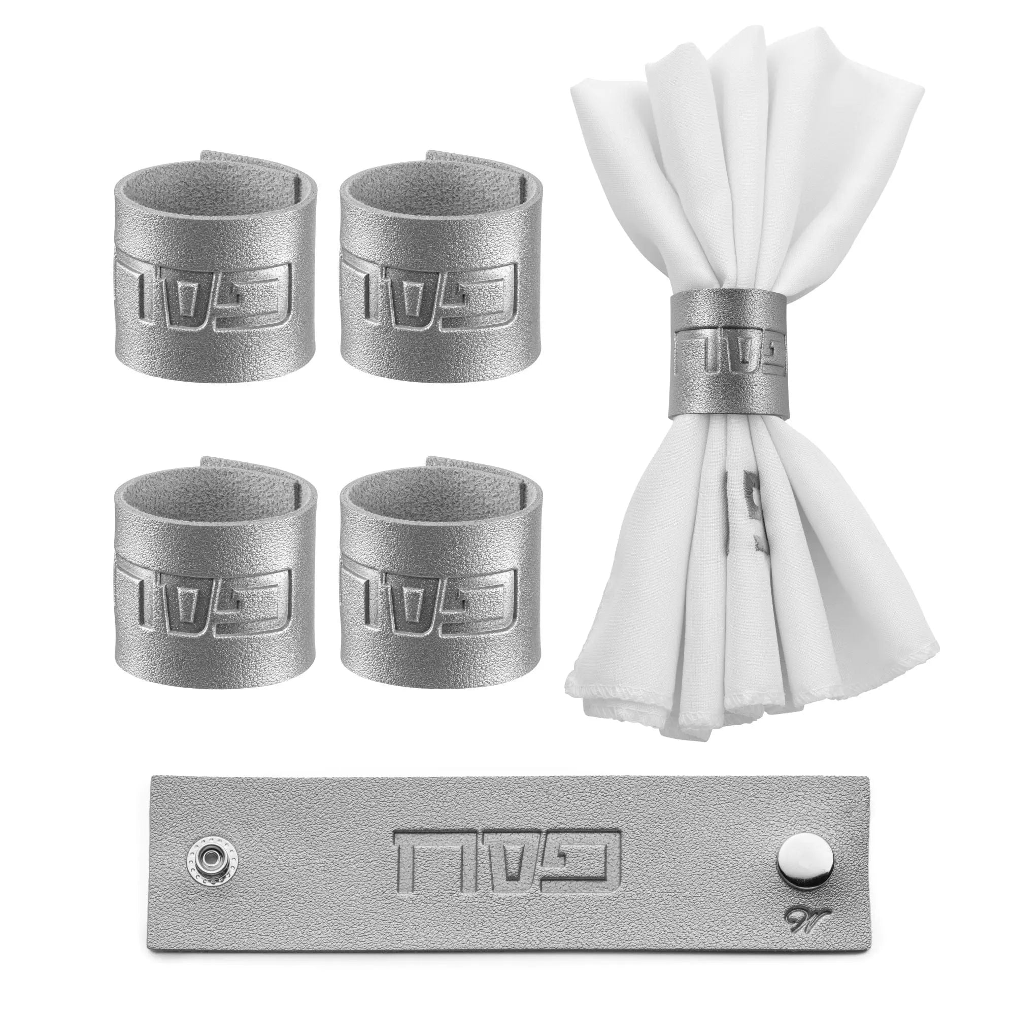 Silver and gold Pesach leather napkin wraps arranged with white napkins, displayed with matching tabletop accessories for holiday dining.