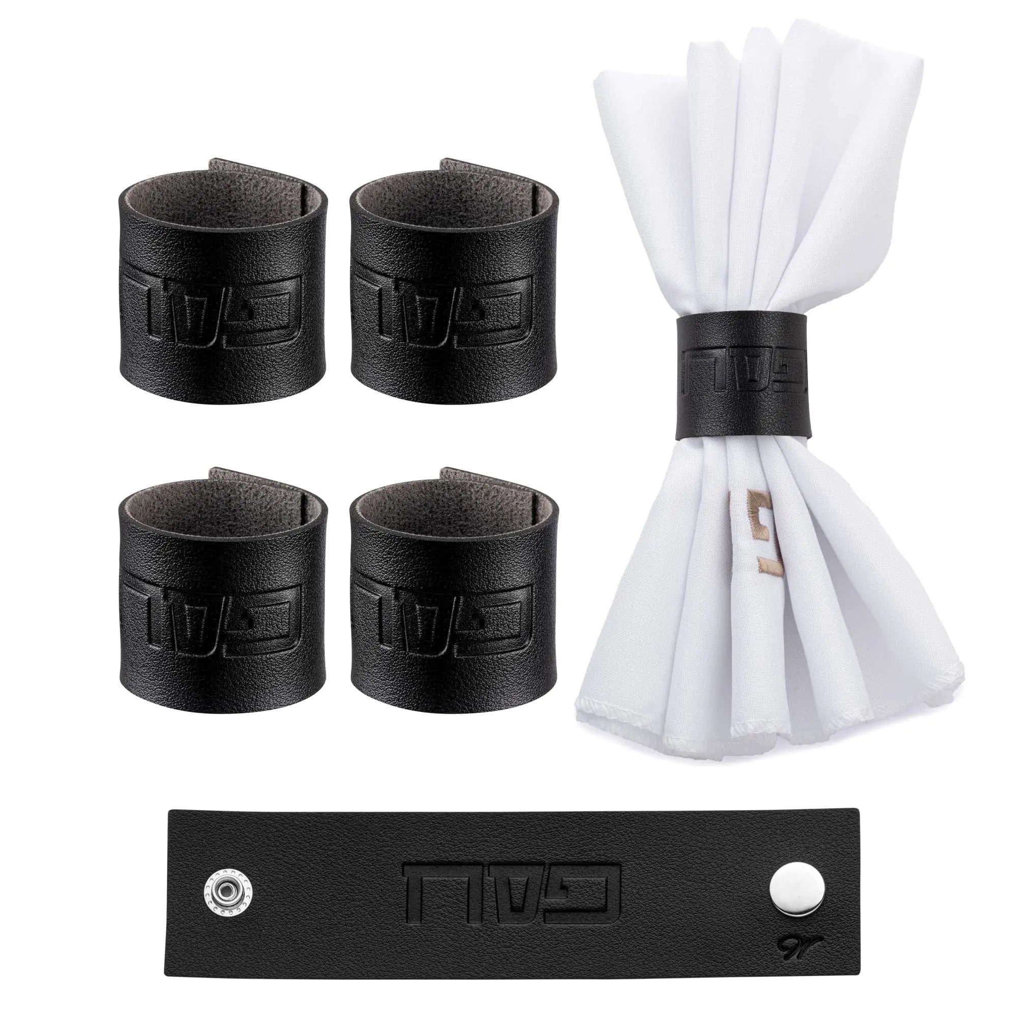 Black leather Pesach napkin rings with white folded napkins and gold and silver metallic accents for holiday table settings.
