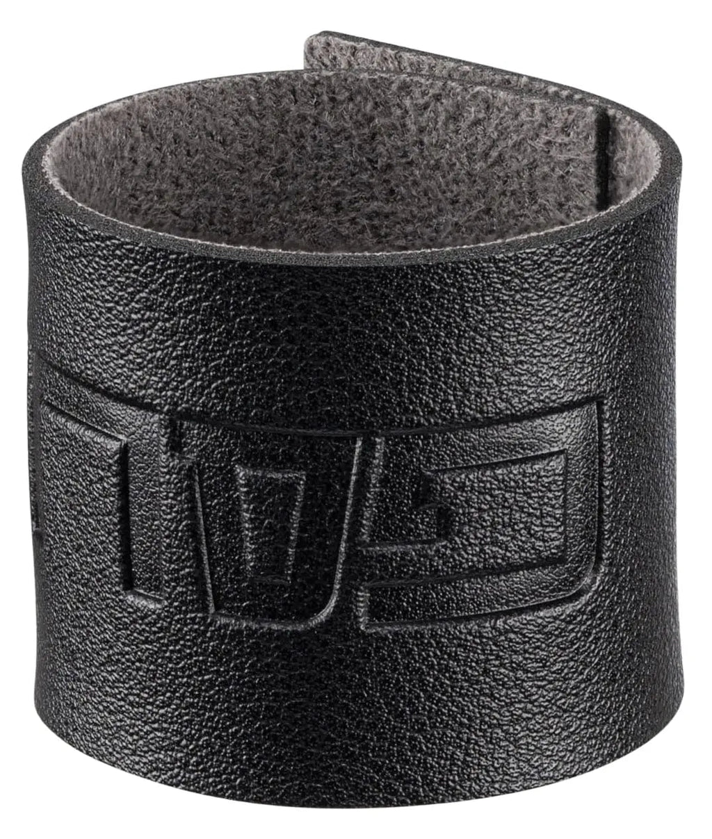 Black leather Pesach napkin ring with embossed design, perfect for holiday table settings and Passover dinners.