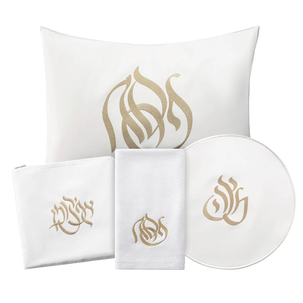 Regal Pesach Set in white and gold leather featuring matching pillow, napkins, and round plate for holiday table décor.