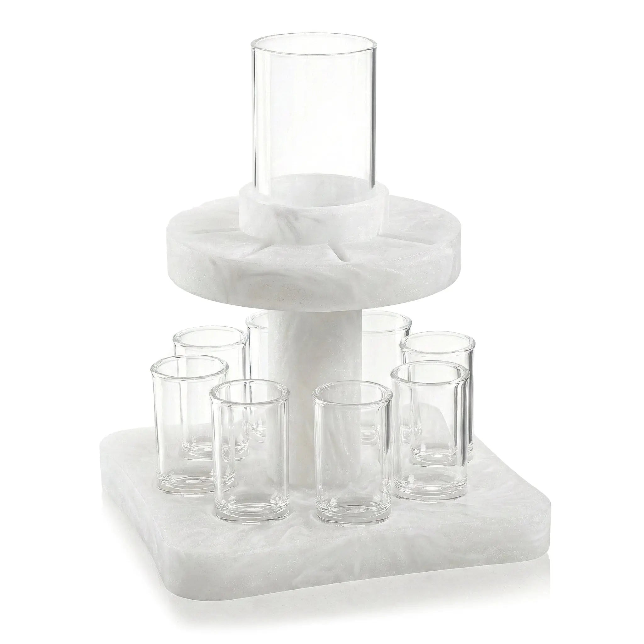 Resin Kiddush fountain with clear glass cups arranged on tiered white base for Shabbat wine service.