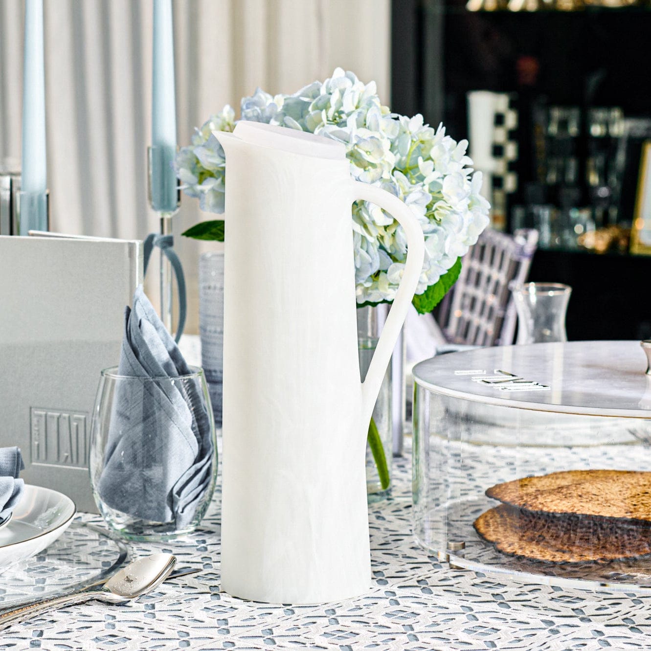 White resin pitcher styled on an elegant Shabbat table setting – Waterdale Collection