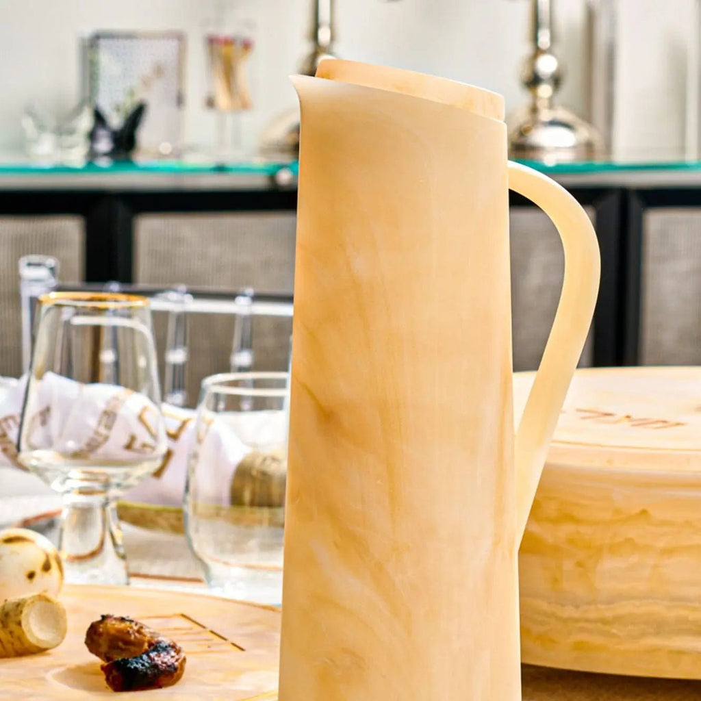 Beige resin pitcher styled on an elegant Shabbat table setting – Waterdale Collection